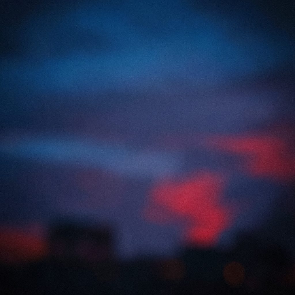 wide cinematic blue gradient background with soft glowing light and shallow depth of field, calm technology mood